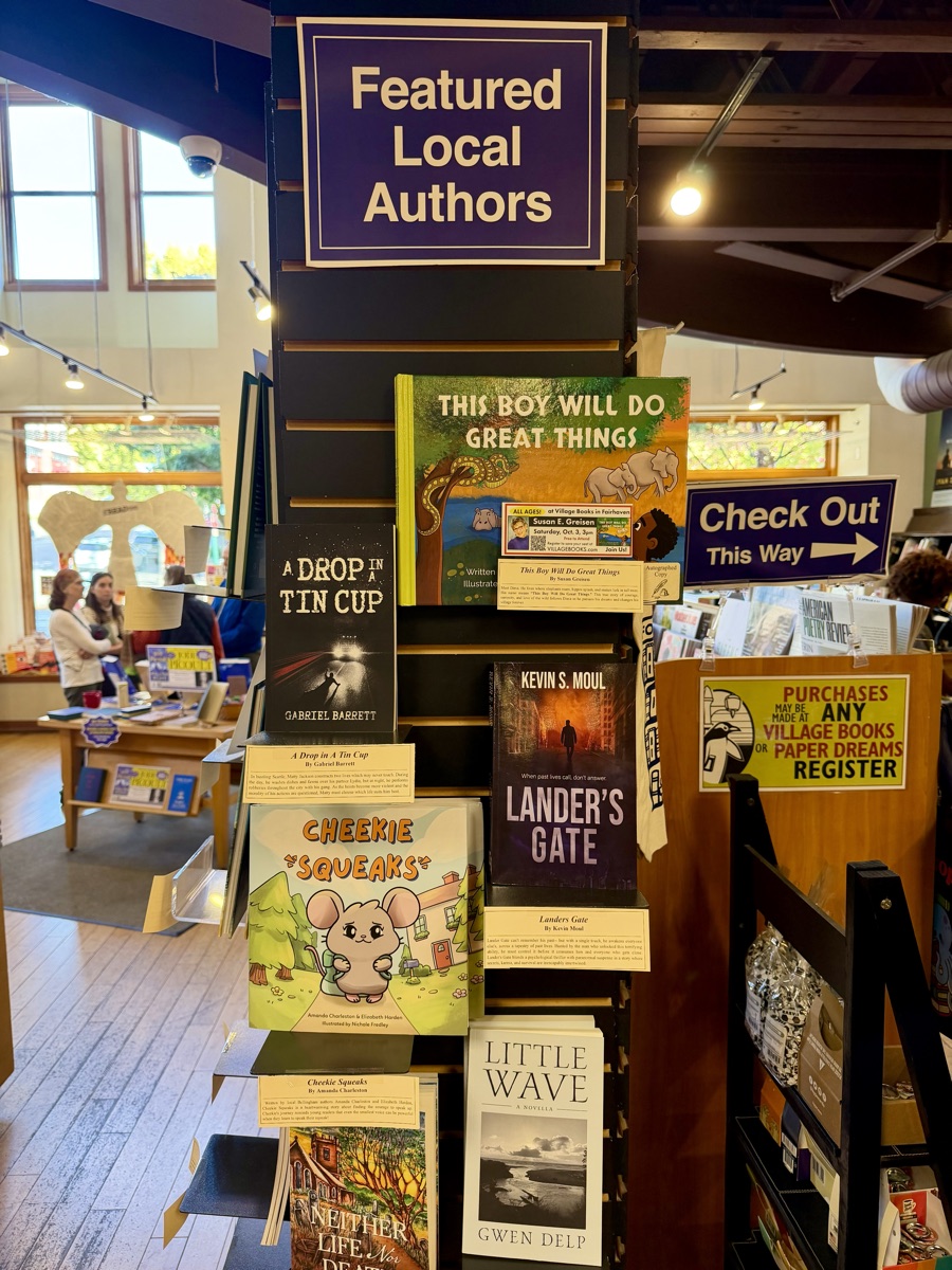 Kevin S. Moul's novel Lander's Gate displayed on the Featured Local Authors wall at Village Books in Fairhaven, Bellingham